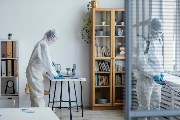 People disinfecting a biohazard area