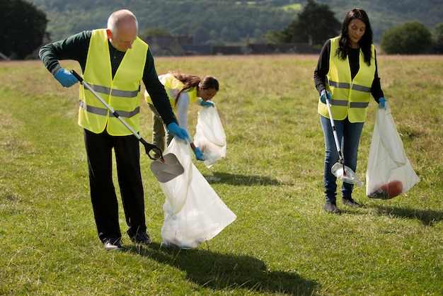 Free Photo people doing community service by collecting trash