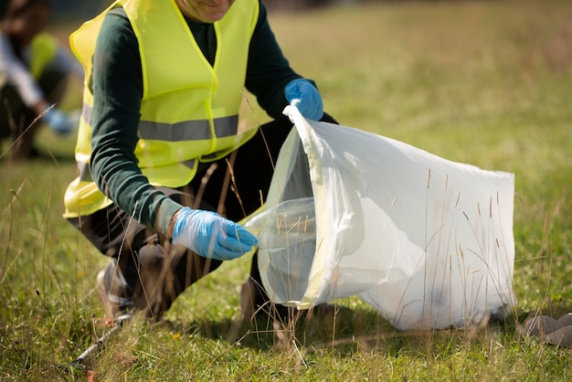 Free Photo people doing community service by collecting trash