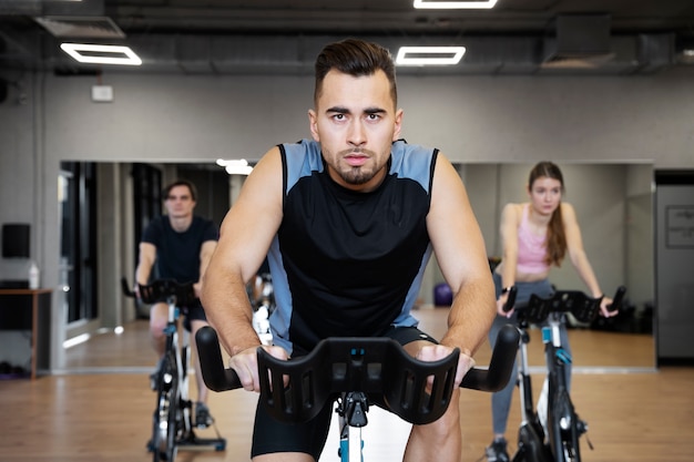 People doing indoor cycling