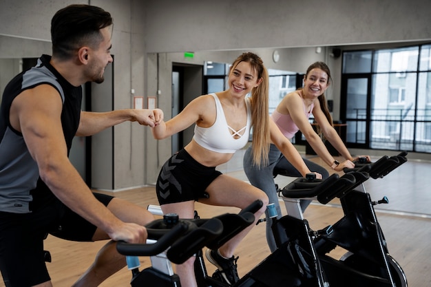 Free Photo people doing indoor cycling