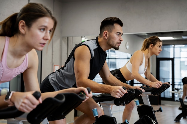 Free Photo people doing indoor cycling