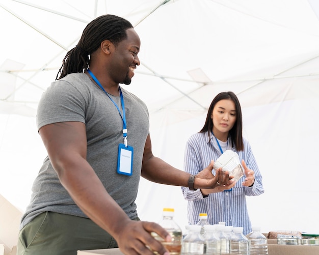 Free Photo people doing volunteer work at a foodbank