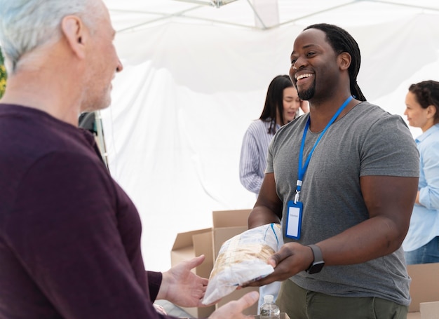 Free Photo people doing volunteer work at a foodbank