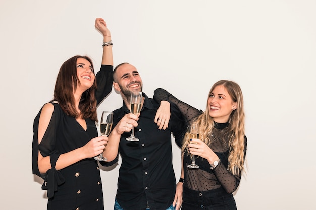 People drinking champagne from glasses