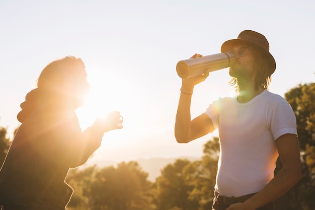 People drinking in countryside