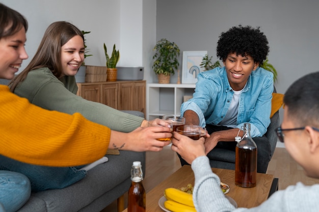 Free photo people drinking kombucha at a gathering