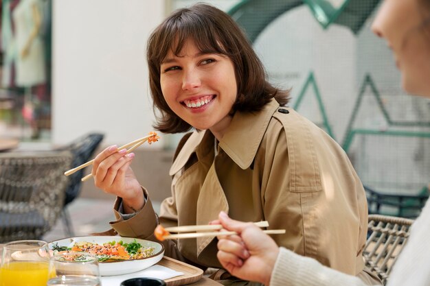 People eating delicious salmon bowl