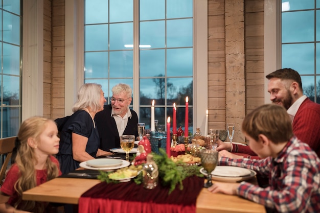 People enjoying a festive christmas dinner together