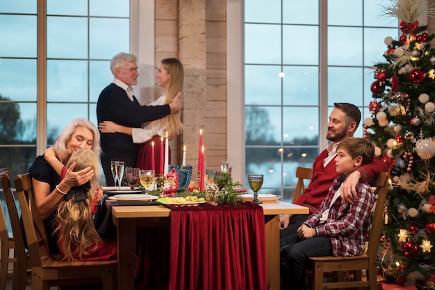 People enjoying a festive christmas dinner together