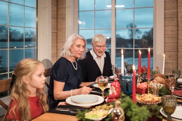 People enjoying a festive christmas dinner together