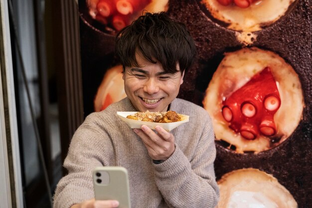 People enjoying japanese street food