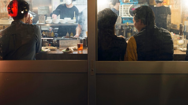 Free Photo people enjoying traditional japanese food court