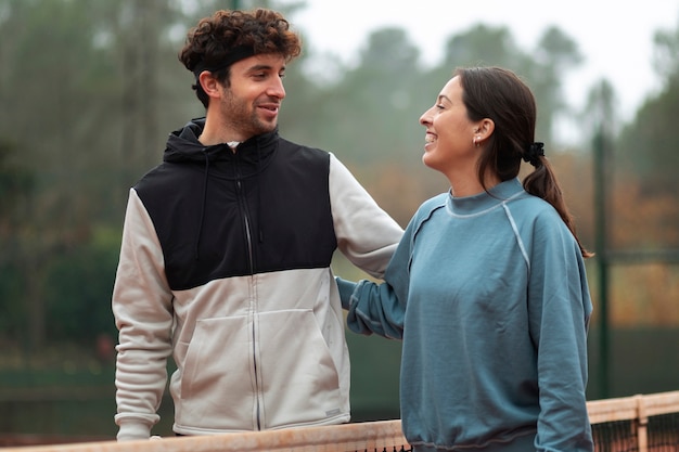 People getting ready for tennis game in winter time