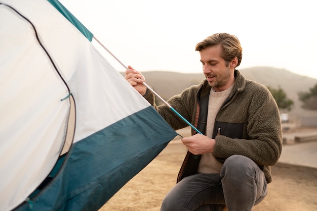 People getting their tent ready for winter camping