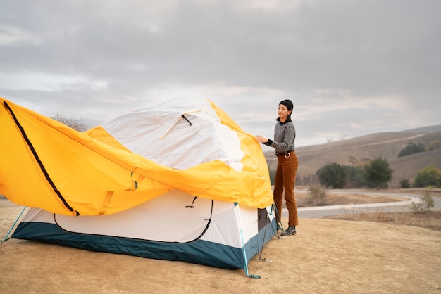 People getting their tent ready for winter camping