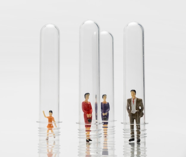 Free Photo people in glass tubes during the coronavirus pandemic for protection