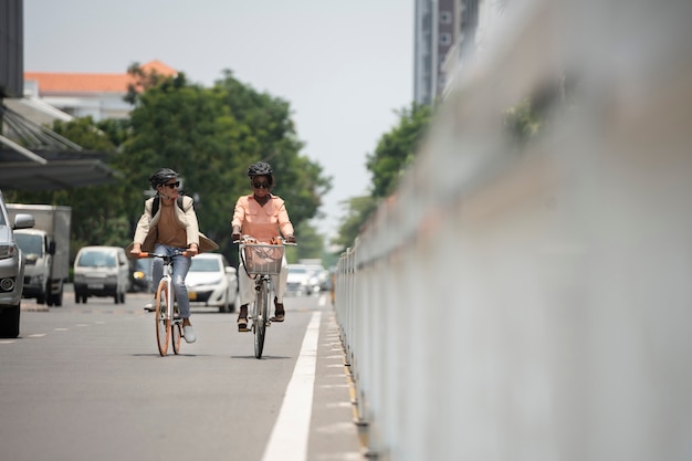 People going to work on bicycle full shot