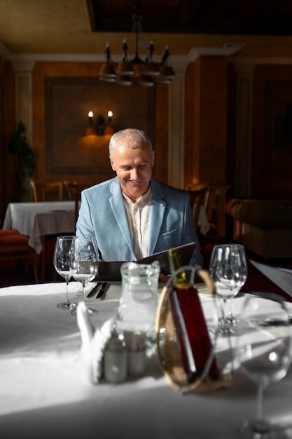 Free Photo people having dinner in luxurious restaurants