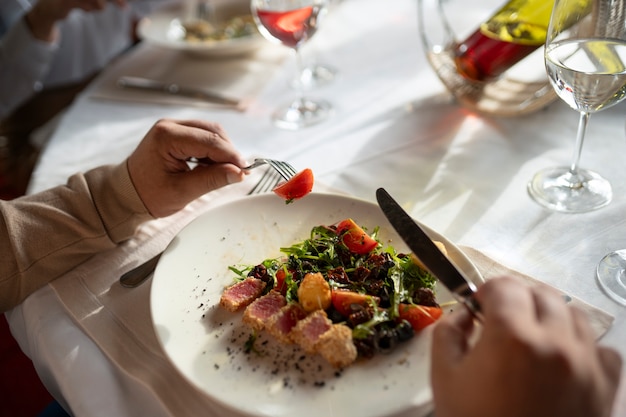 Free Photo people having dinner in luxurious restaurants