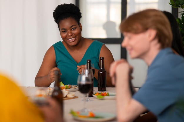 People having food and drinks at a dinner party