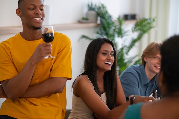 People having food and drinks at a dinner party