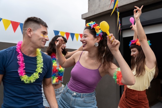 Free Photo people having fun and celebrating carnival