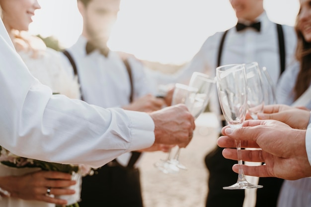 People having some drinks at a beach wedding