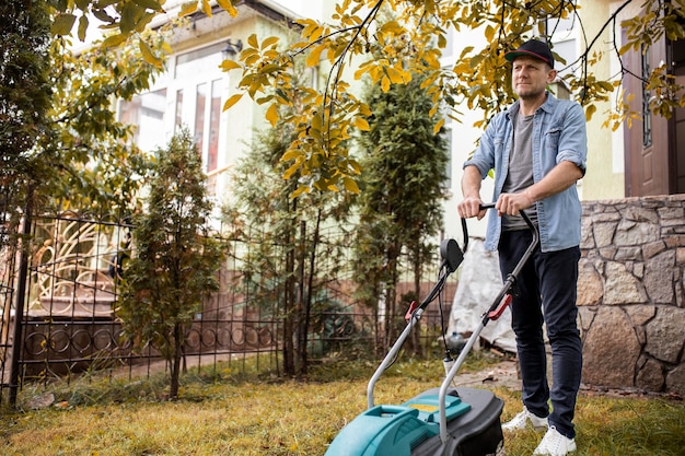 Free photo people helping neighbors with grass lawn