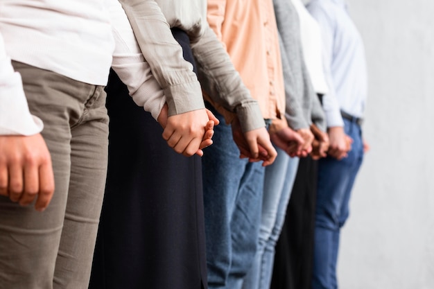 People holding hands at a group therapy session