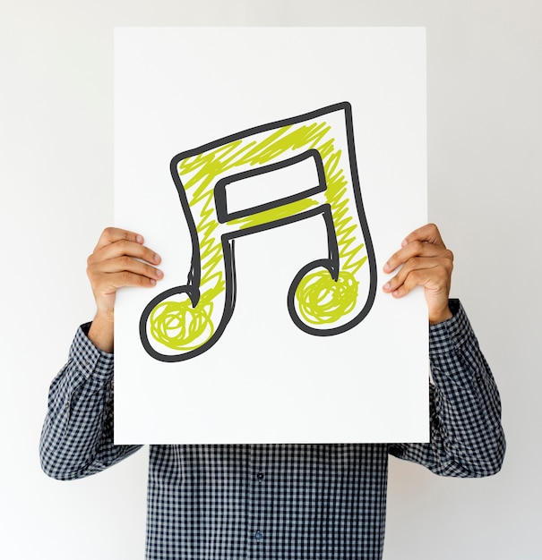 Free Photo people holding music icon on a paper