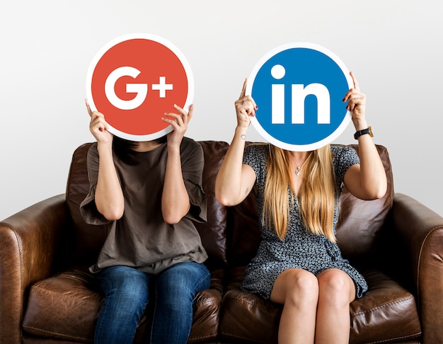 Free Photo people holding social media icons