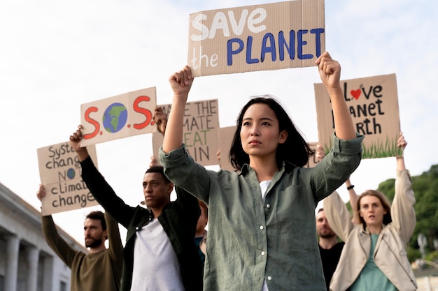 Free photo people joining a global warming protest