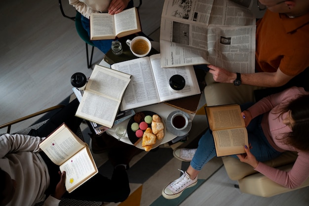 People at the library reading and learning from books