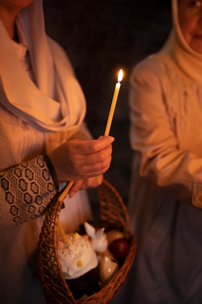 Free Photo people lighting candles in church in celebration of greek easter