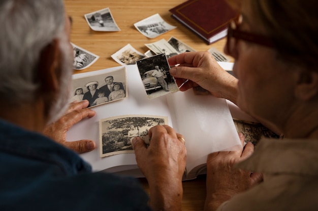 People looking over picture album