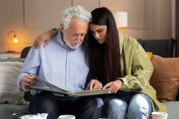 People looking over picture albums