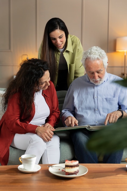 People looking over picture albums