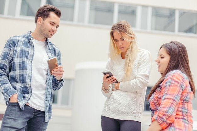 Free photo people looking at woman's phone