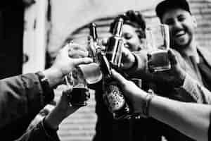 Free photo people making a toast with beers