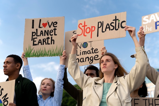 Free photo people marching together in global warming protest