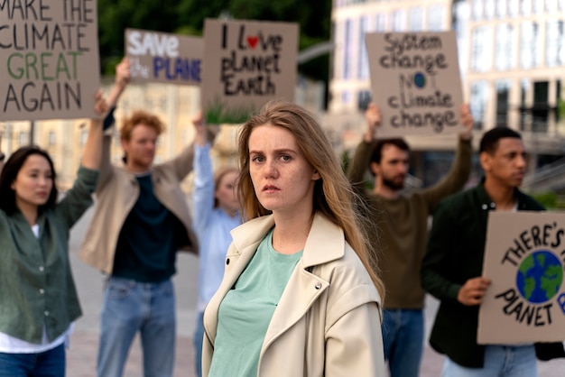 Free photo people marching together in global warming protest