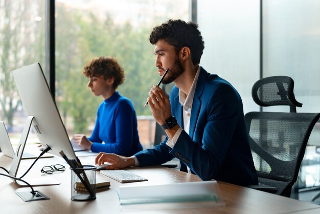 People in the office analyzing and checking finance graphs