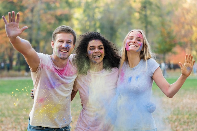 People playing with colored paint at festival