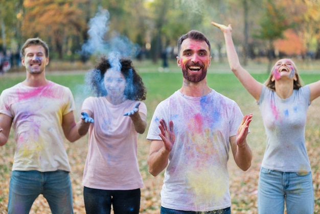 Free photo people playing with paint at holi