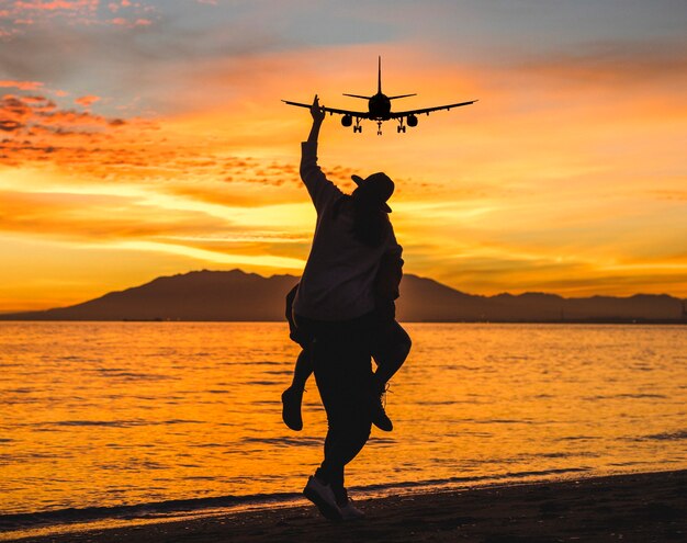 People portrait with plane flying in the sky