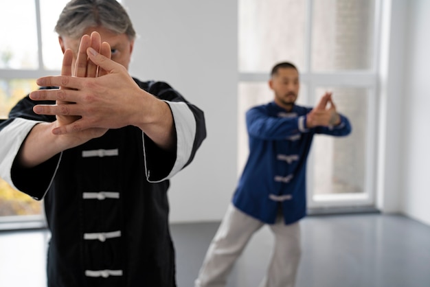 People practicing tai chi together front view