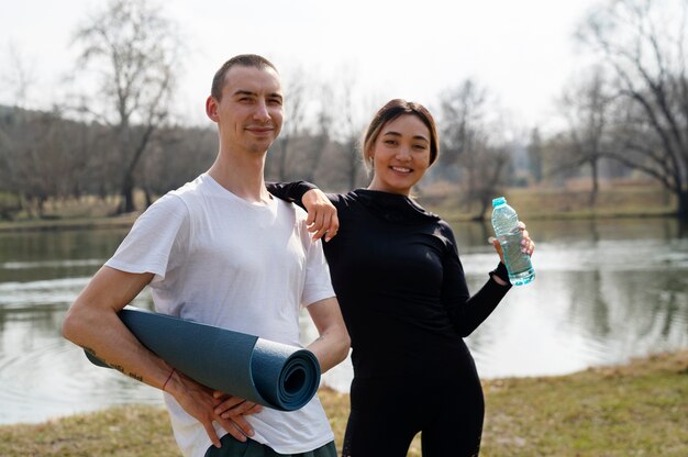 People practicing yoga outside