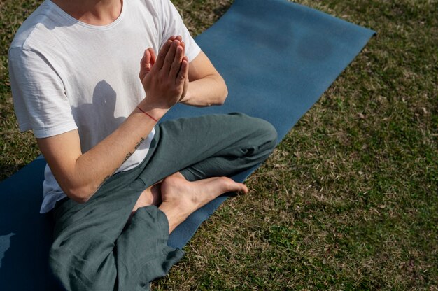 People practicing yoga outside