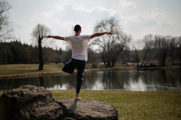 People practicing yoga outside